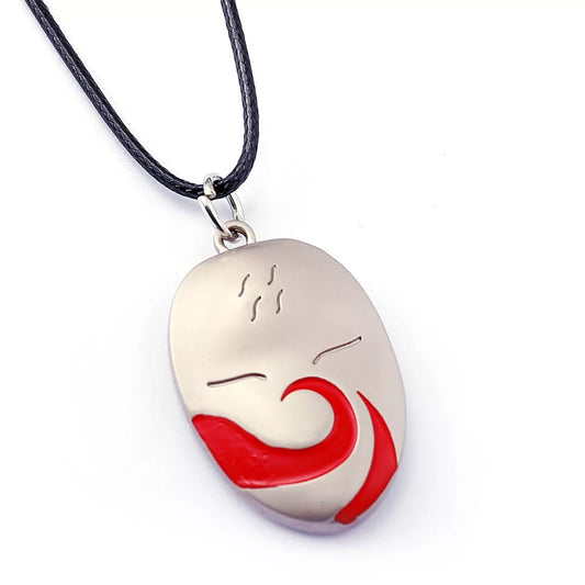 Pendant with red and white design on a black cord against a white background