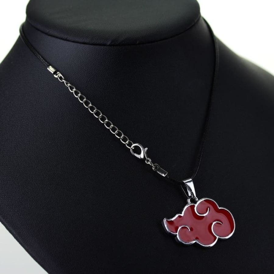Necklace with a red cloud pendant on a black mannequin bust.