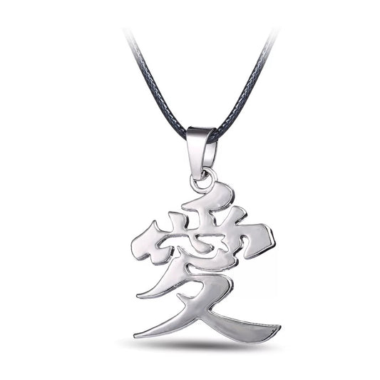 Silver pendant with a Chinese character on a white background