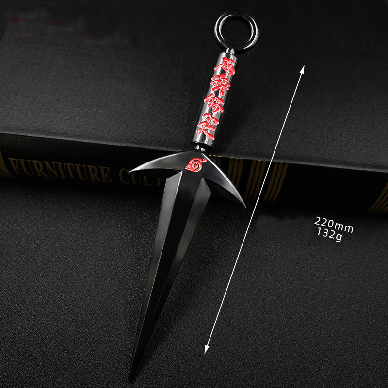 Black and red decorative object on a dark surface