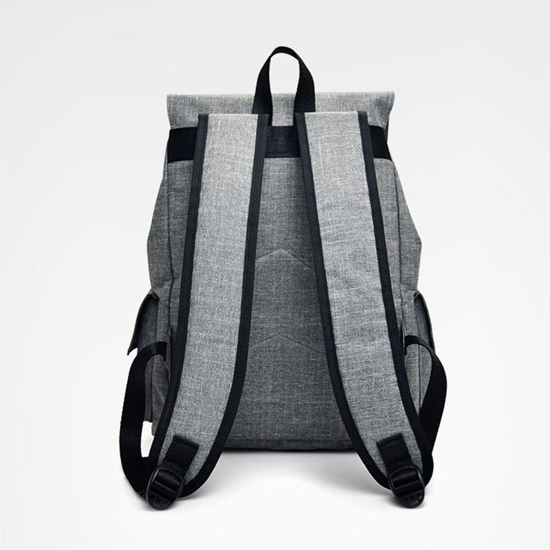 Gray backpack with black straps on a white background