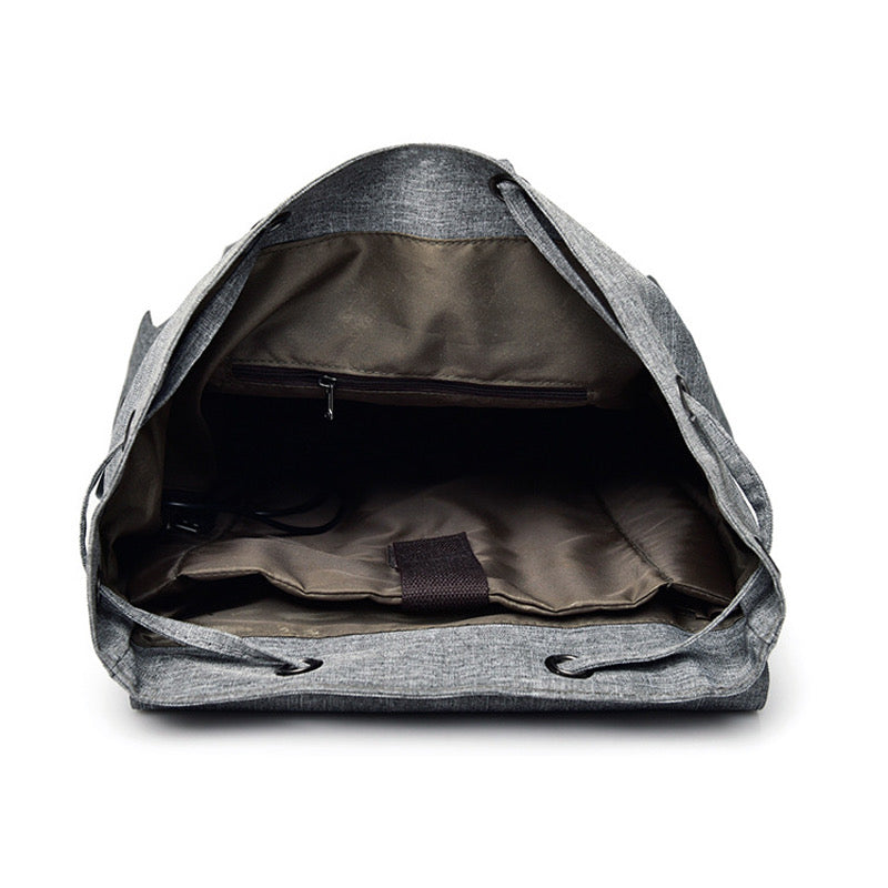 Gray backpack with open front compartment on a white background