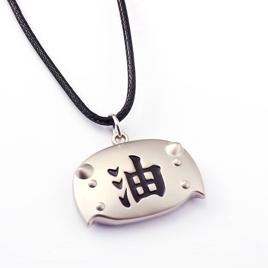Silver pendant with black characters on a white background