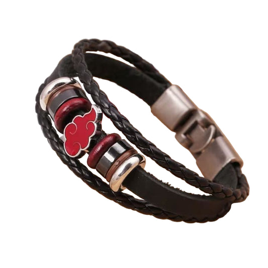 Black braided leather bracelet with red cloud symbol on a beige surface