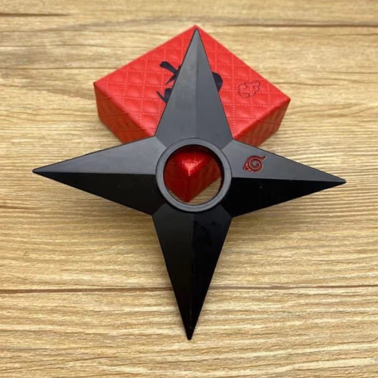 Black and red weapon-like object on a wooden surface with text and app icons at the bottom.