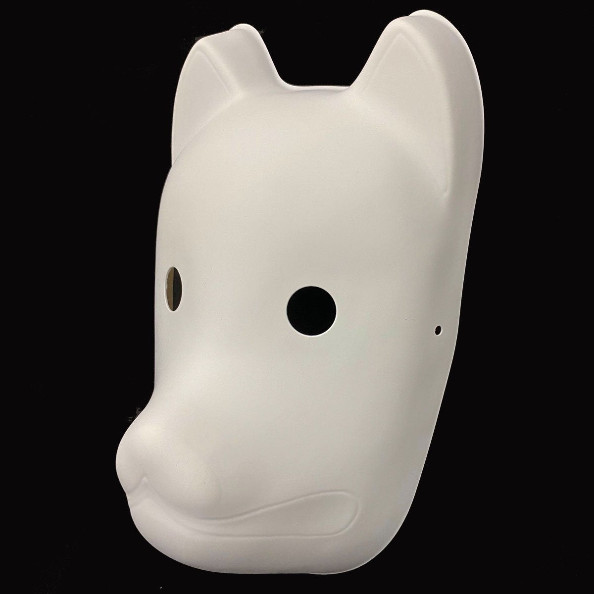White dog-shaped mask on a black background