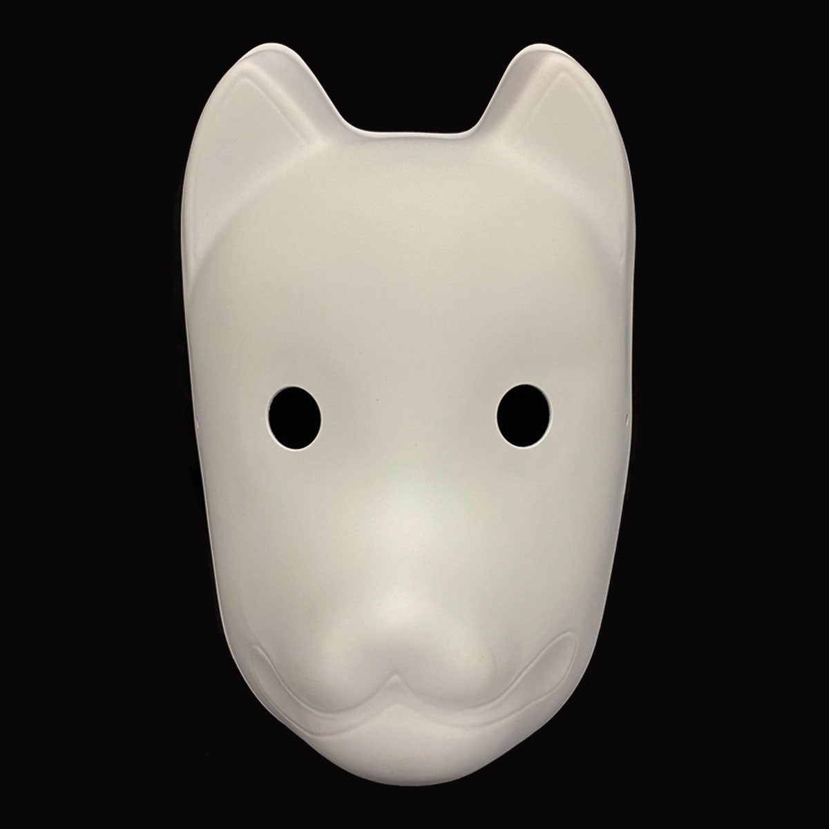 White dog mask with black eyes on a black background